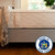Side view of a mattress with New York state flag logo, emphasizing local craftsmanship.