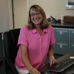 Lori Pullan at her desk, contributing to the smooth running of Jamestown Mattress.