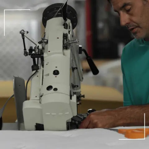 Inside the Jamestown factory, showcasing the final sewing touches on a mattress.