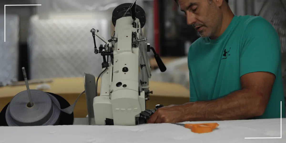 Factory direct mattress, Jamestown worker tape edging bed, symbolizing direct savings.