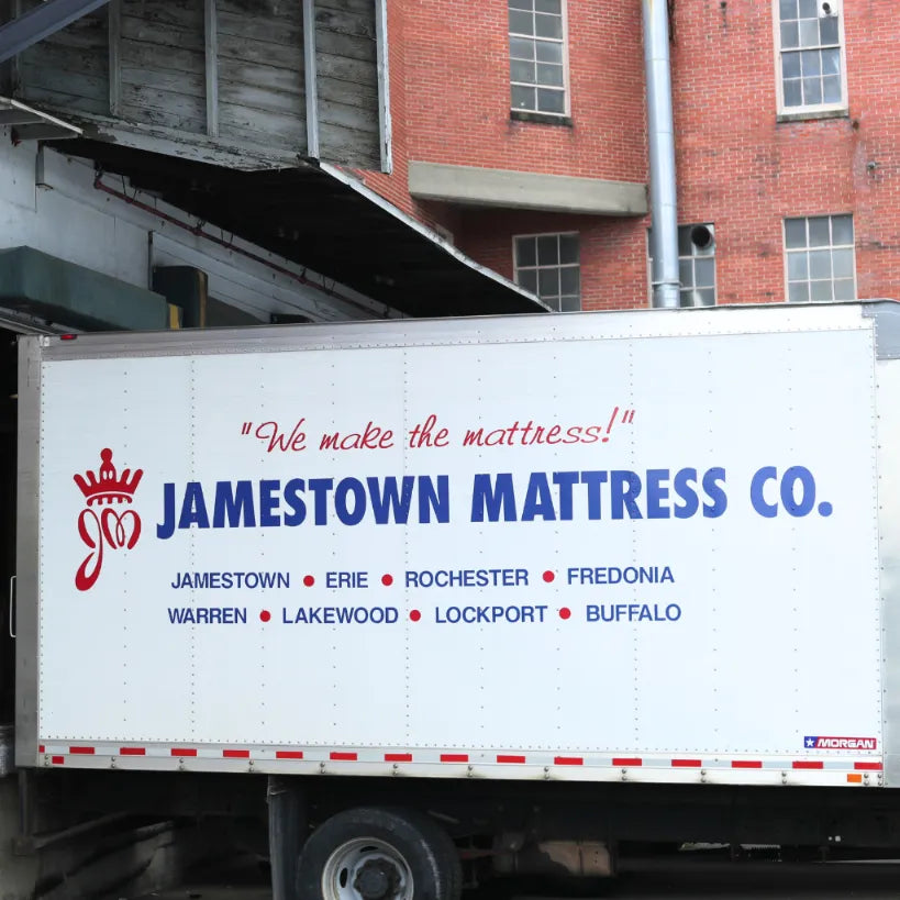 White delivery truck at Jamestown Mattress, ready for loading, serving Erie, Rochester, Buffalo.
